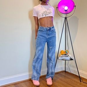 Medium wash high waisted denim jeans.